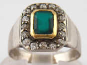 Appraisal: A white metal emerald and old cut diamond ring emerald