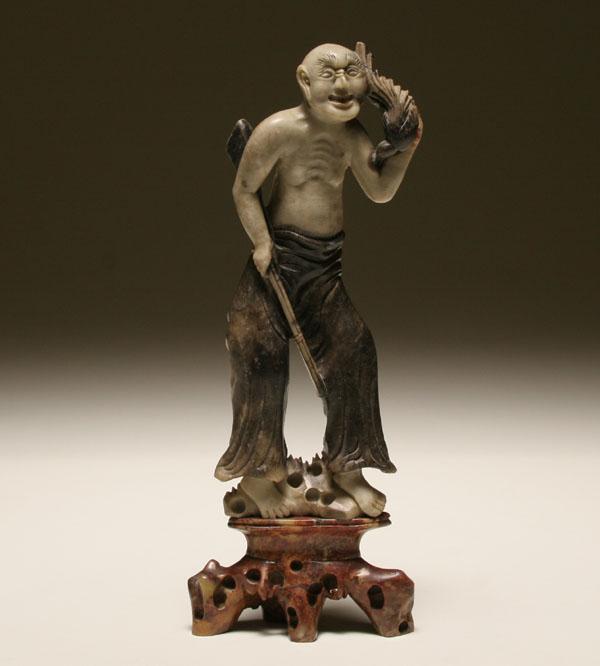 Appraisal: Chinese soapstone figure of a hunter with bird H Good