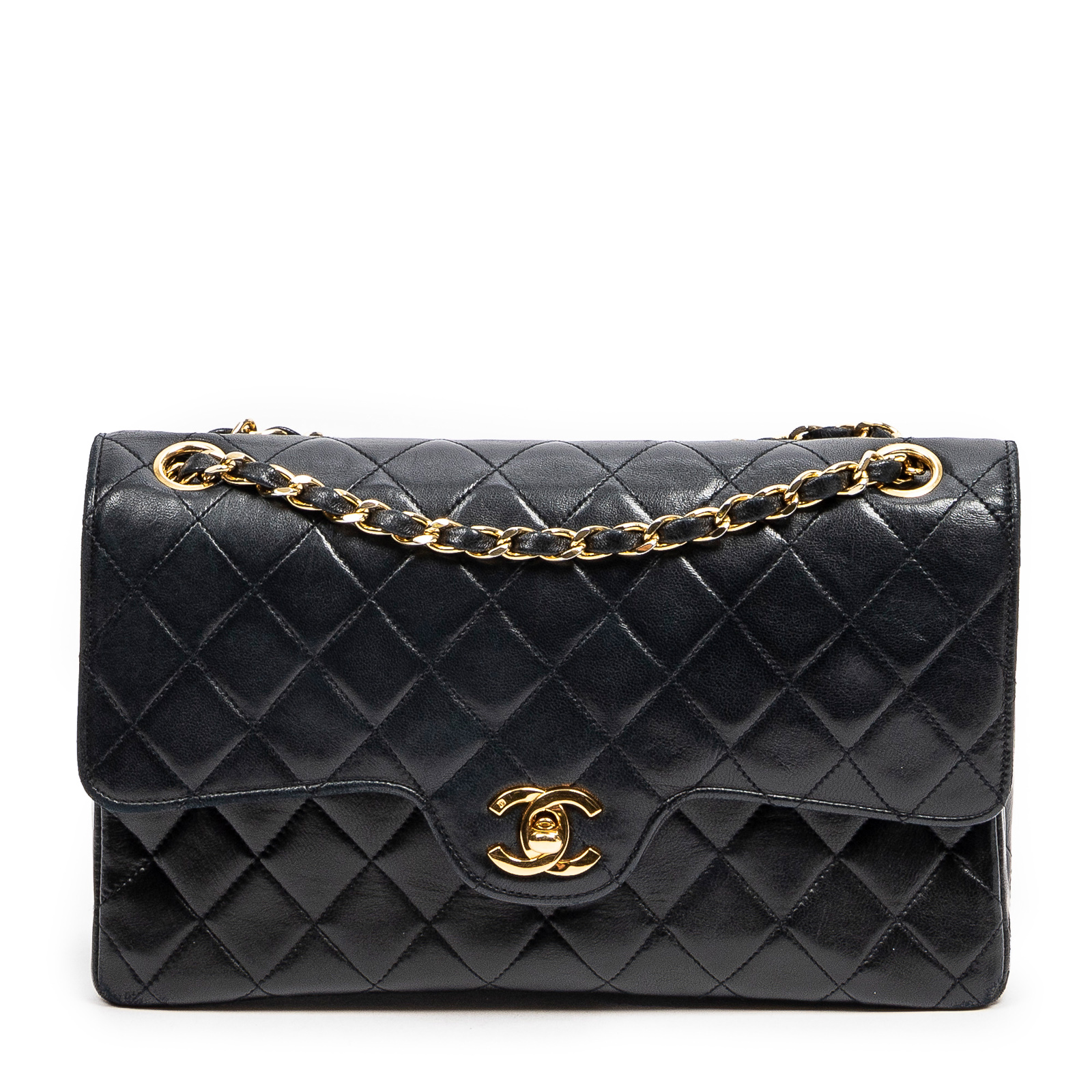 Appraisal: A CHANEL TURN LOCK DOUBLE FLAP BAG A navy quilted