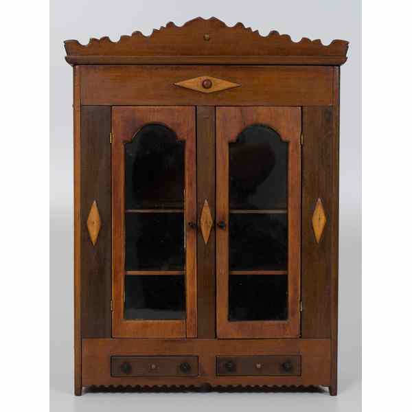 Appraisal: Miniature Victorian Cabinet American A miniature wooden clothes press with