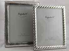 Appraisal: Two modern silver faced mahogany photo frames with strut backs