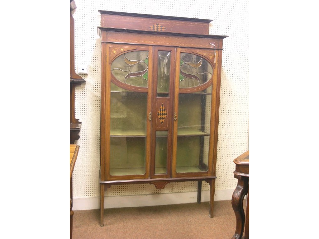 Appraisal: An Edwardian inlaid mahogany display cabinet pair of glazed doors