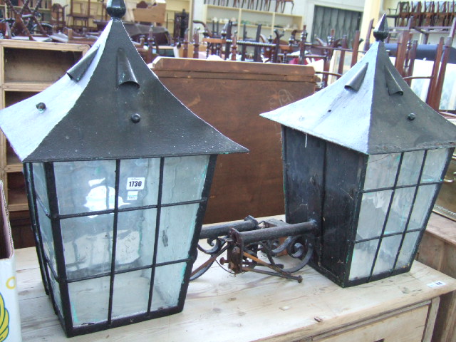 Appraisal: A pair of wrought iron exterior lanterns with spear finials