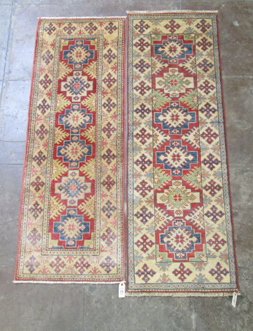 Appraisal: TWO SIMILAR HAND KNOTTED ORIENTAL AREA RUGS Pakistani Caucasians '