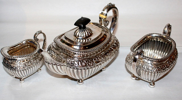 Appraisal: A LATE VICTORIAN THREE PIECE SILVER TEA SET decorated with