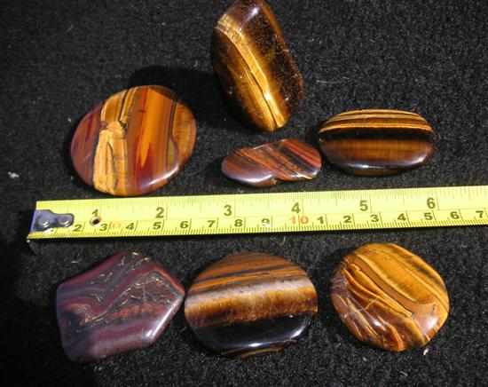 Appraisal: SEVEN POLISHED TIGER IRON South Africa and W A