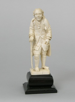 Appraisal: A Continental Carved Ivory Figurine of a Scholar A Continental