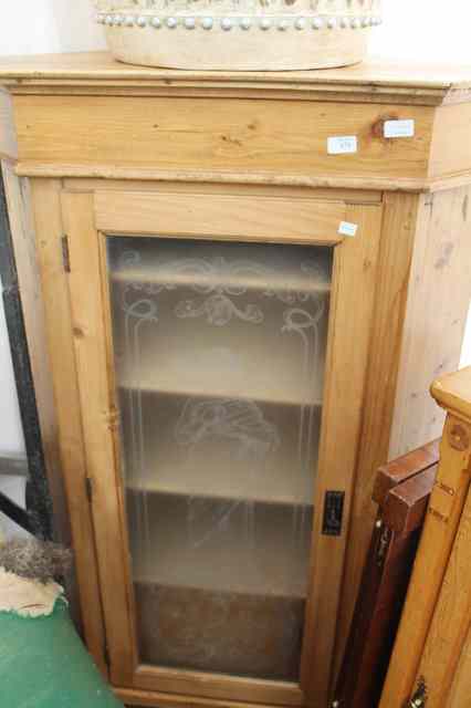 Appraisal: A FLOOR STANDING CONTINENTAL PINE CORNER CUPBOARD the glazed door