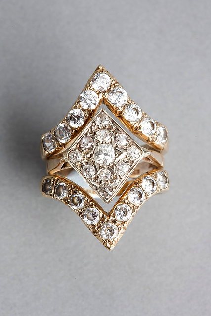 Appraisal: A THREE RING COMBINATION SET central ring with a diamond