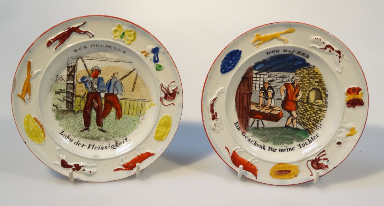 Appraisal: Two early thC pottery children's plates by Thomas Fell each