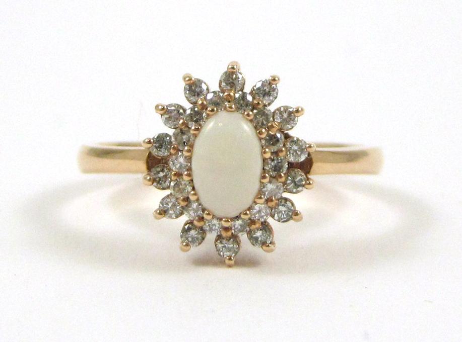 Appraisal: OPAL DIAMOND AND FOURTEEN KARAT ROSE GOLD RING with round-cut