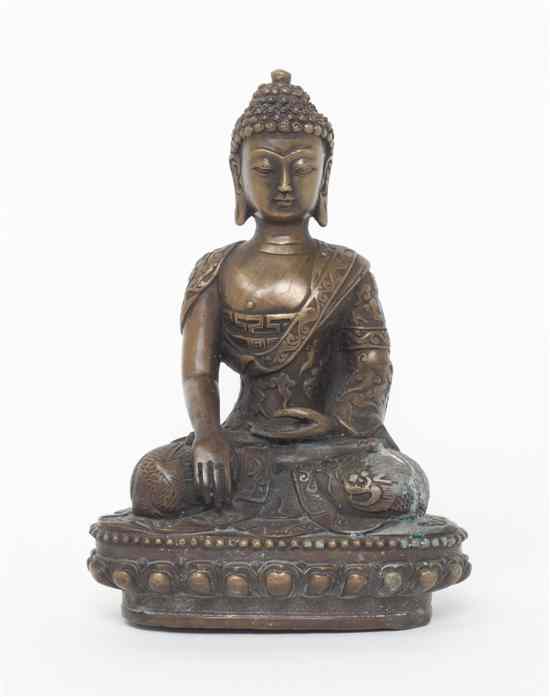 Appraisal: A Bronze Figure of Buddha having snail knot form hair