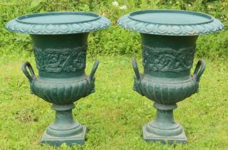 Appraisal: PAIR OF CAST IRON GARDEN URNS Roman Revival Garden Urns