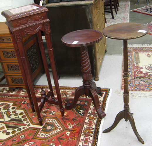 Appraisal: THREE PEDESTAL PLANT STANDS tall Empire style mahogany stand with