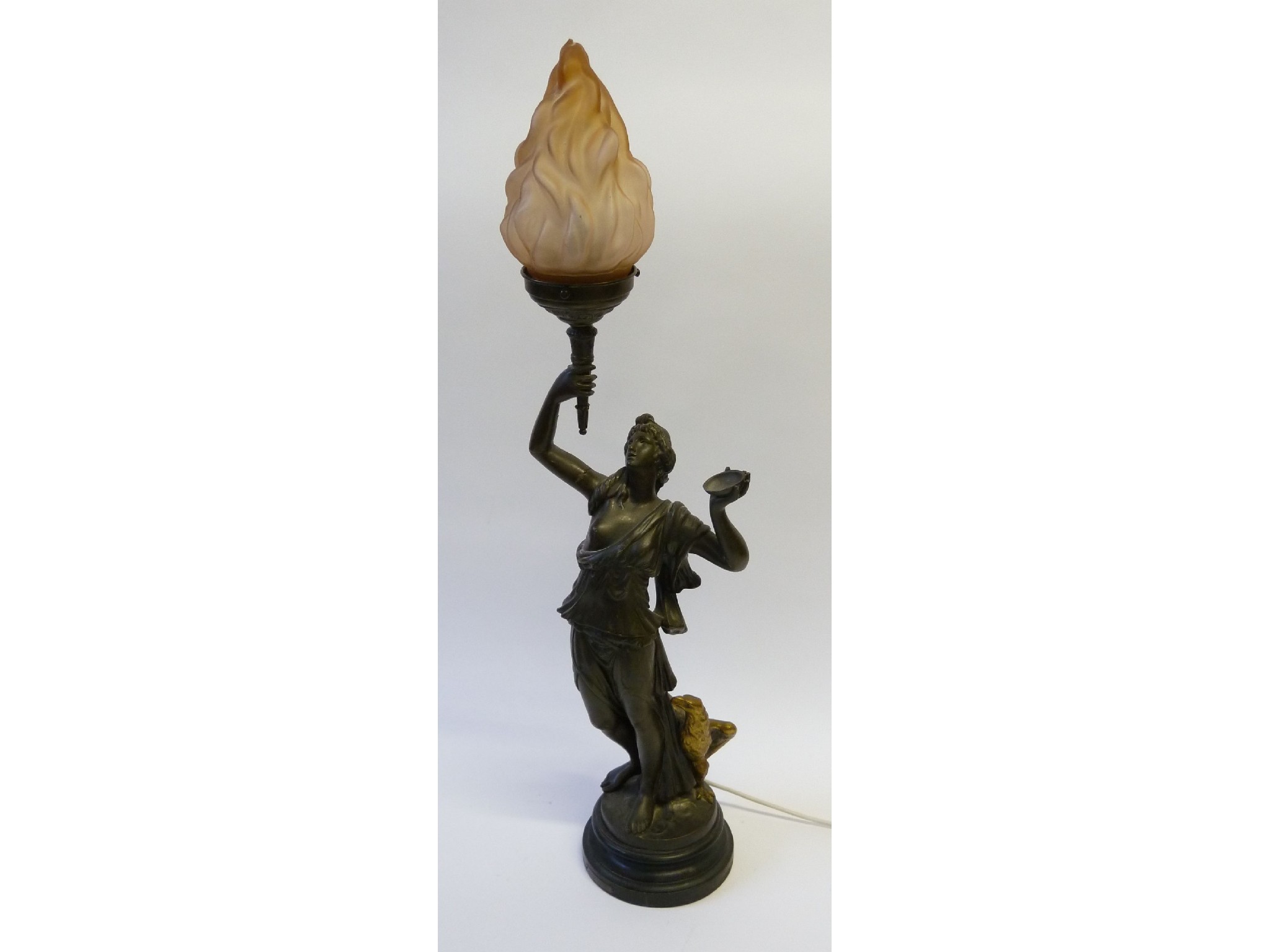 Appraisal: A PATINATED SPELTER FIGURAL ELECTRIC TABLE LAMP in the form