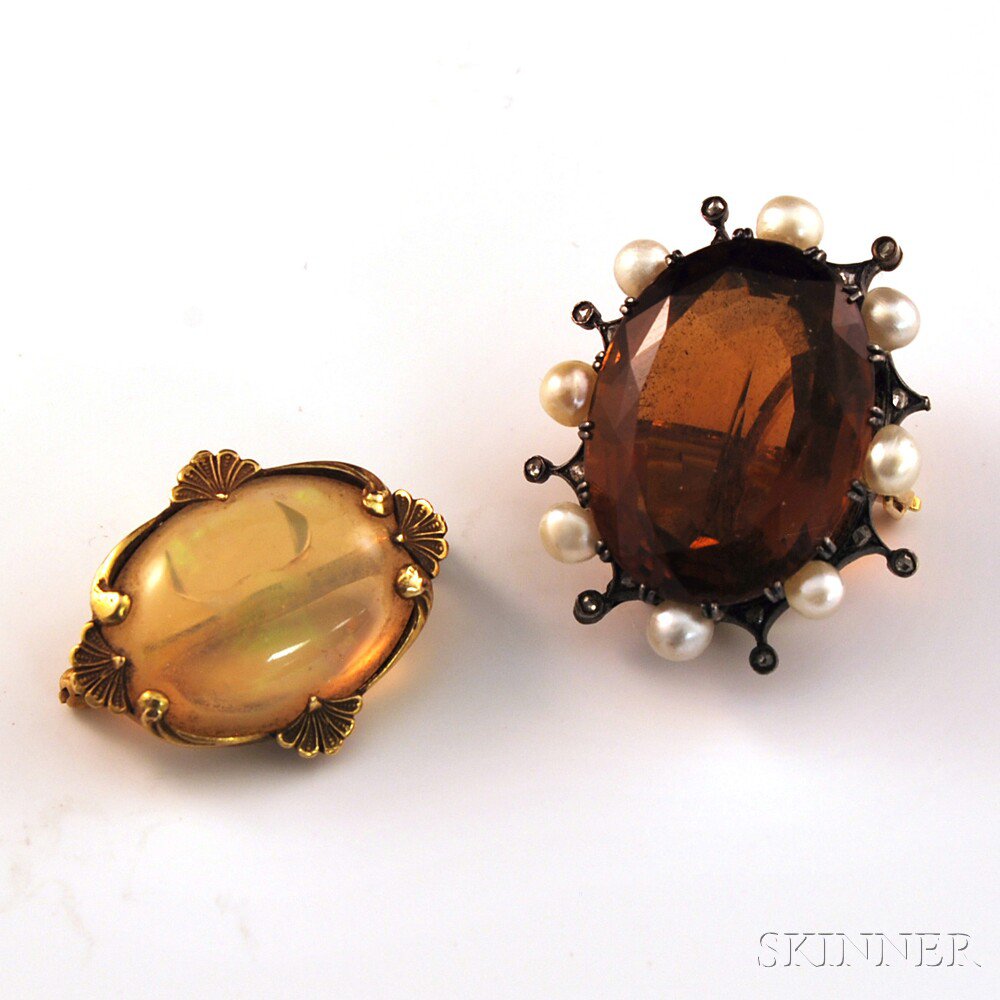 Appraisal: Two Gemstone Pins a gold-backed topaz and pearl pin and