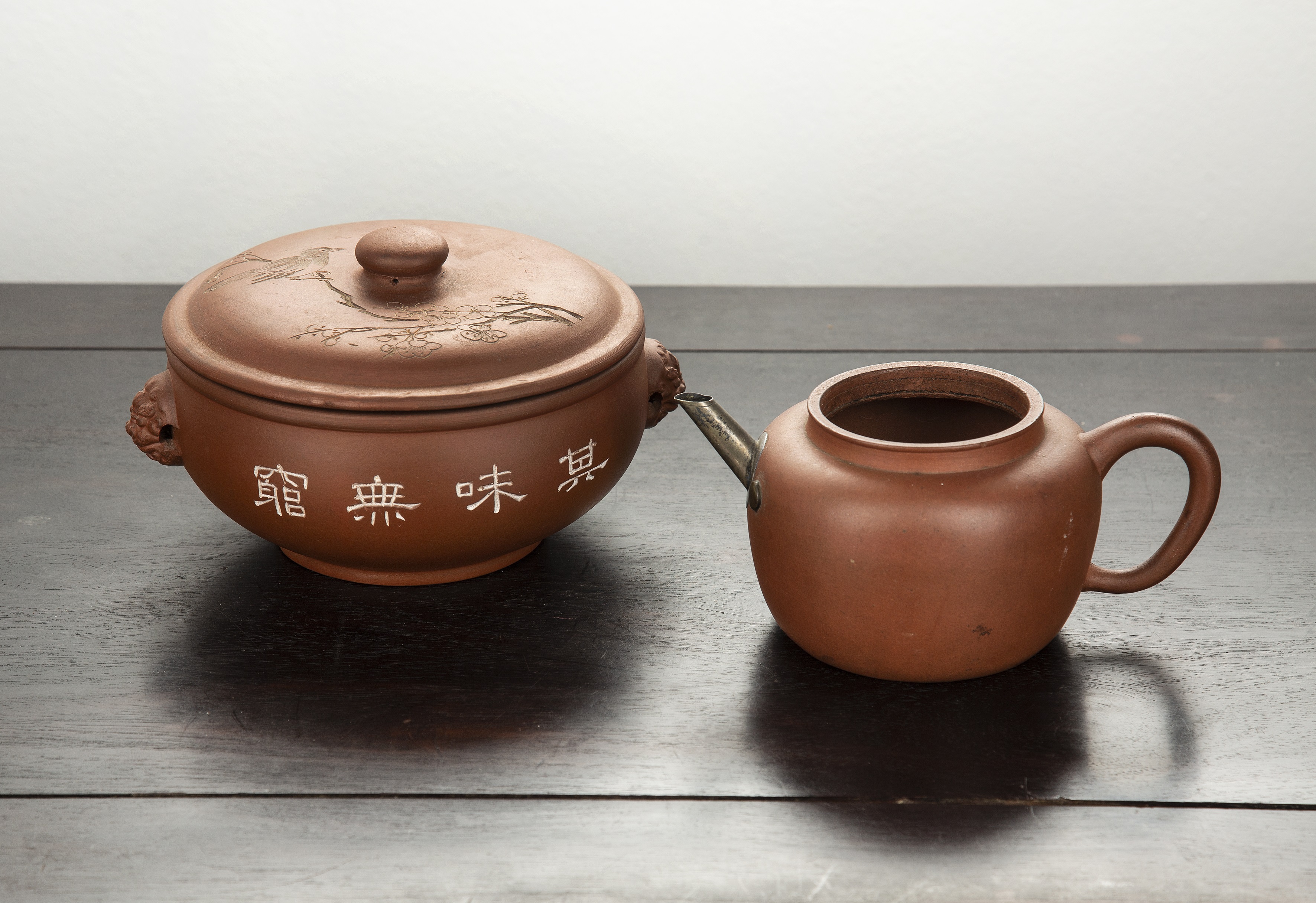 Appraisal: Two Yixing earthenware piecesChinese to include a teapot with two