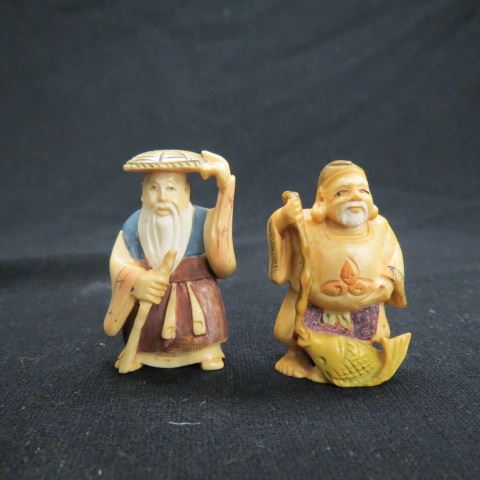 Appraisal: Carved Ivory Netsukes fisherman and old man with hat colorful