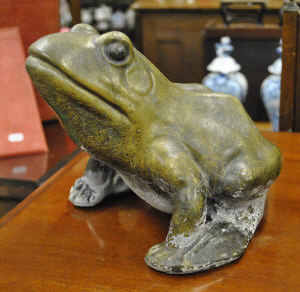 Appraisal: A green glazed cast stone frog cm