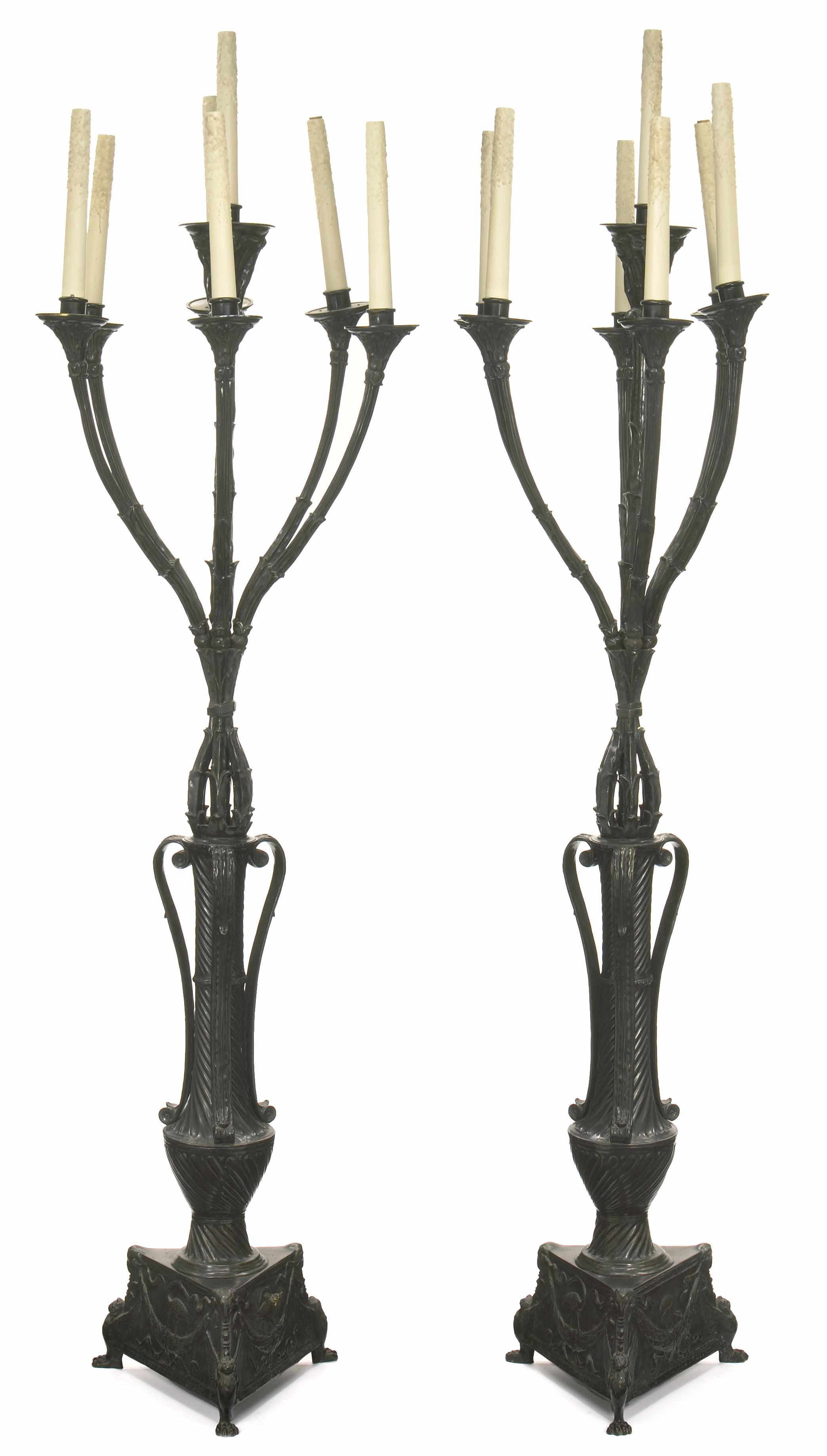 Appraisal: A pair of American patinated bronze seven light torchres attributed