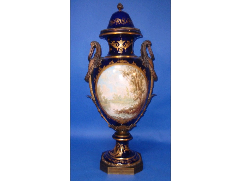 Appraisal: A Sevres style urn with bronze handles and mounts of