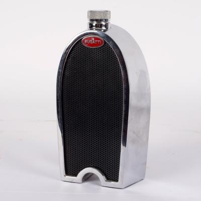 Appraisal: A Ruddspeed Bugatti radiator decanter with enamel radiator badges and