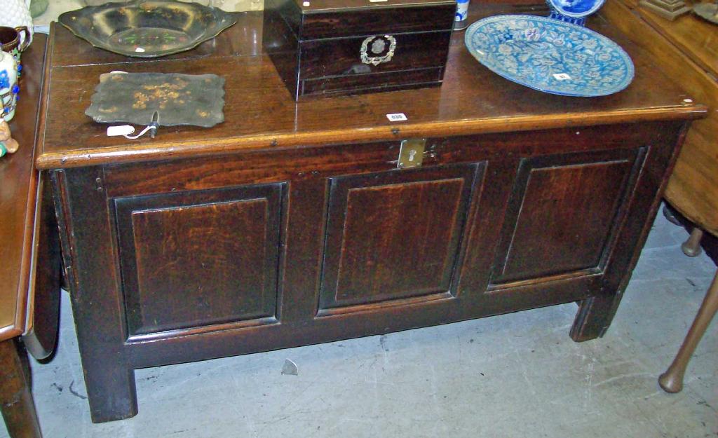 Appraisal: An th century oak coffer with inset fielded panels -