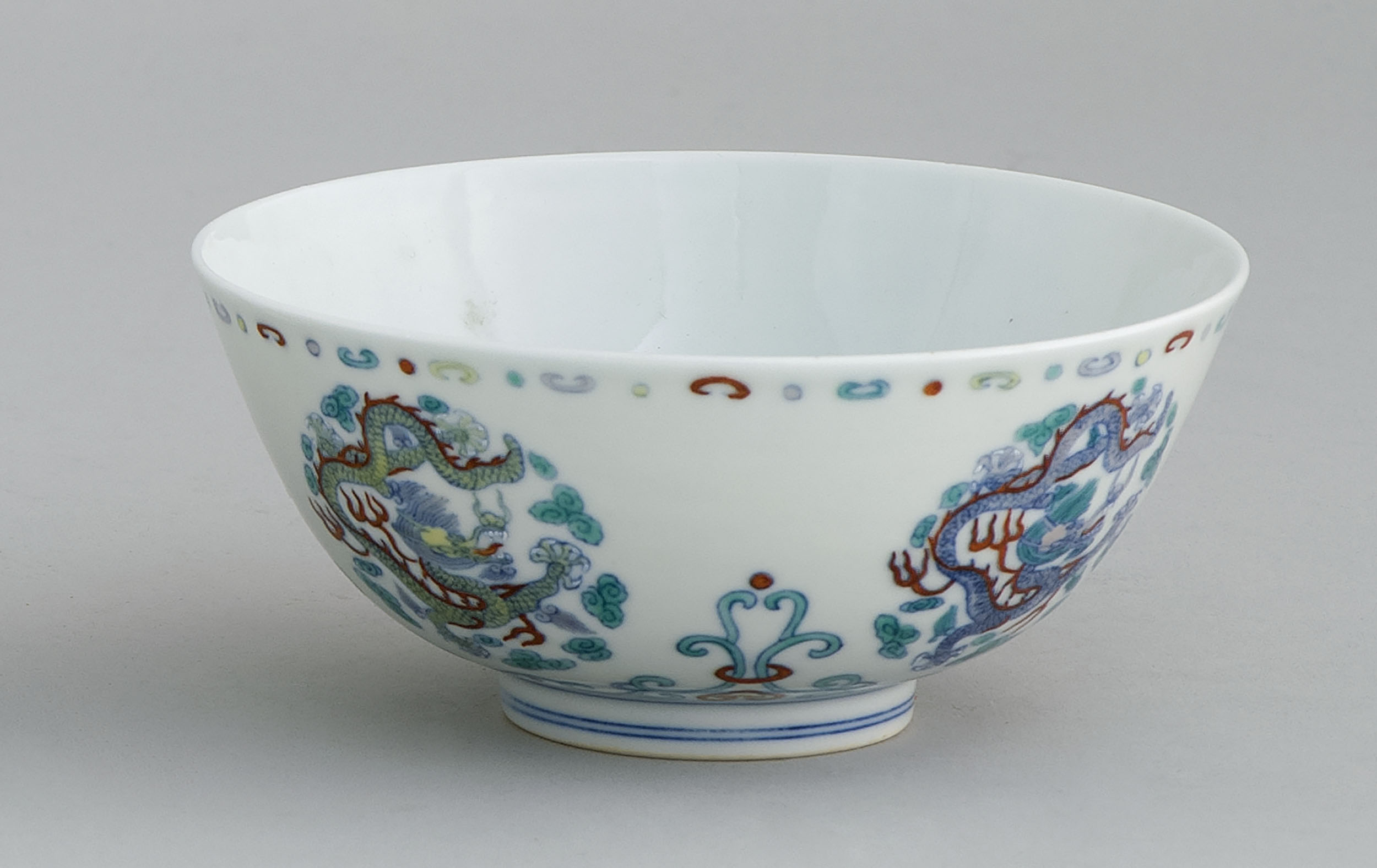 Appraisal: DOUCAI PORCELAIN BOWL With dragon rondel design Six-character Yongzheng mark