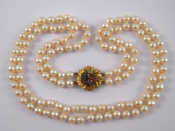 Appraisal: A two row cultured pearl necklace with a yellow metal