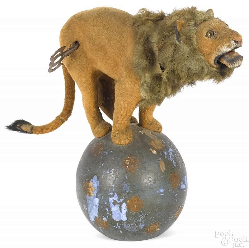 Appraisal: French Descamps clockwork lion on ball French Descamps clockwork lion