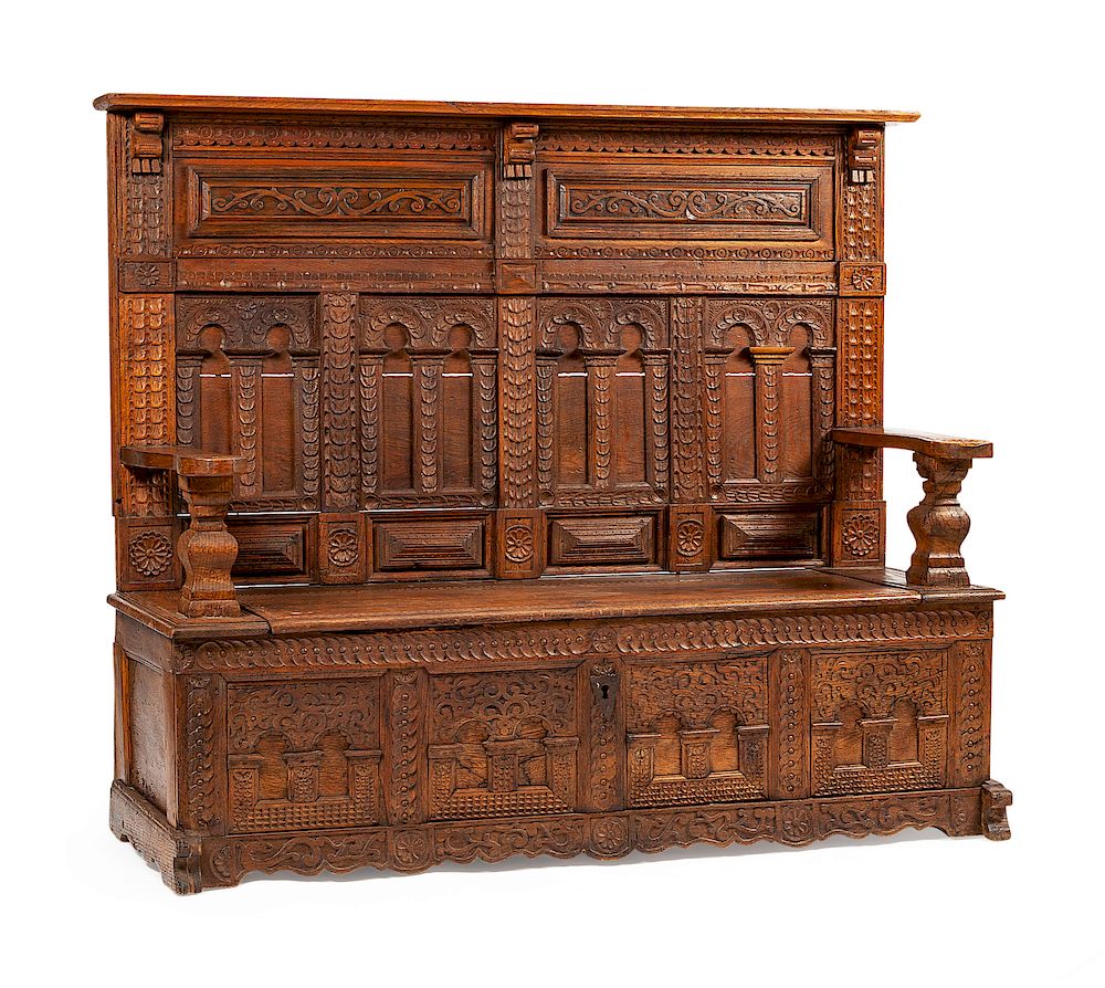 Appraisal: A Continental Carved Oak Settle A Continental Carved Oak Settle