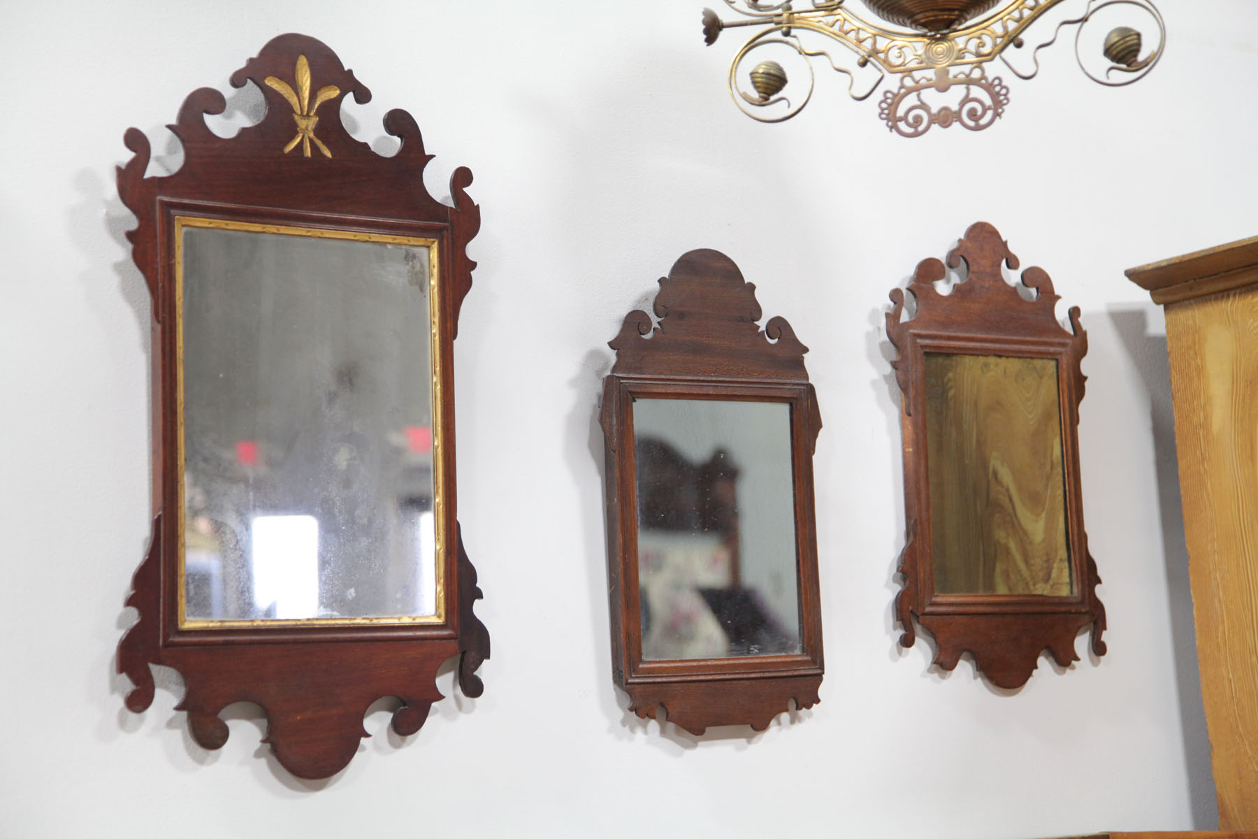 Appraisal: THREE SMALL CHIPPENDALE STYLE MIRRORS American late th century Two