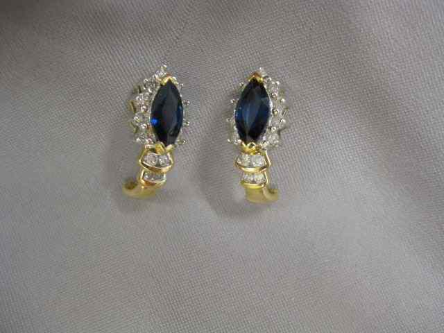 Appraisal: Sapphire Diamond Earrings marquise deep blue gems surrounded by diamonds