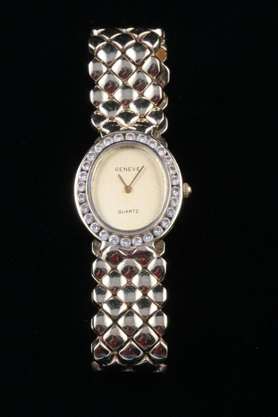 Appraisal: LADY'S K YELLOW GOLD AND DIAMOND WRISTWATCH BY GENEVE Oval