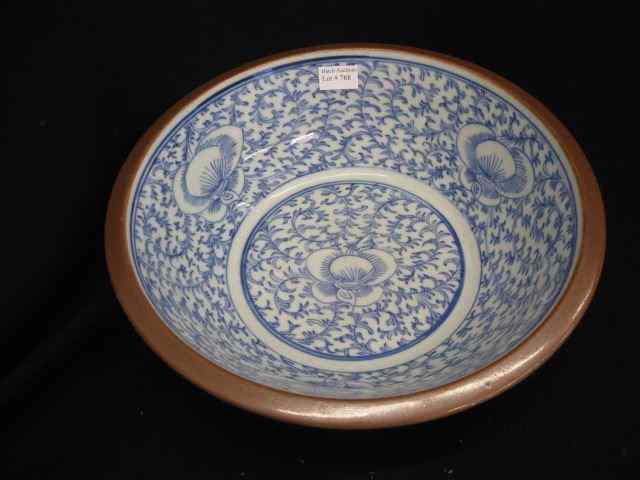 Appraisal: Chinese Blue White Decorated Bowl floral vine brown exterior glaze