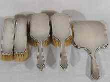 Appraisal: A silver dressing table set of two hairbrushes two clothes