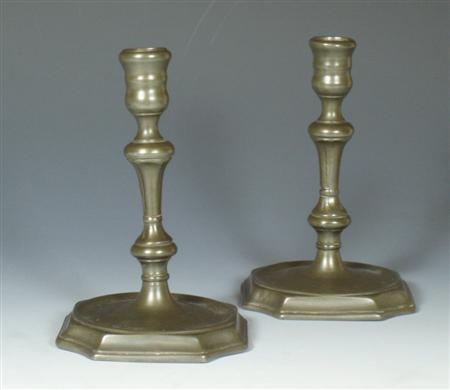 Appraisal: A pair of th century English pewter candlesticks each with