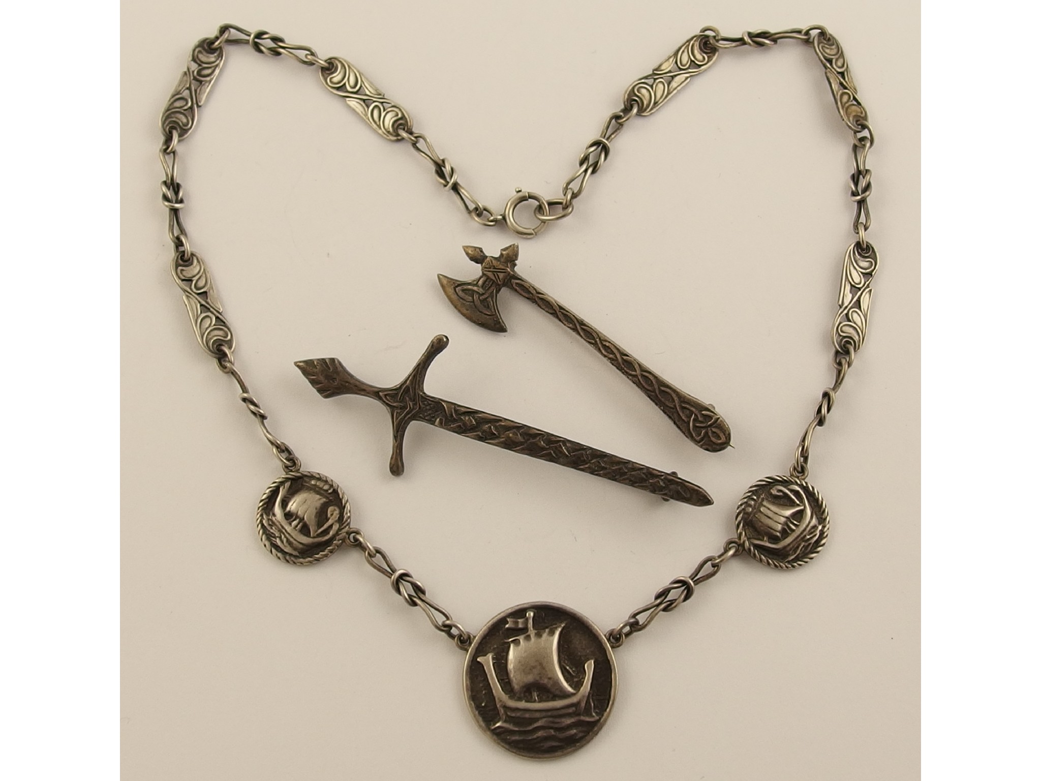 Appraisal: A silver Alexander Ritchie style necklace and two brooches