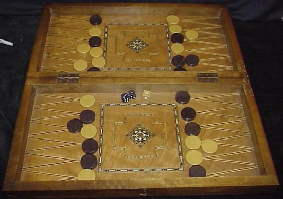 Appraisal: Folding backgammon board probably Moroccan wood and mother-of-pearl inlay with