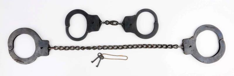 Appraisal: Lot Of Leg Irons Lot includes two leg iron handcuffs