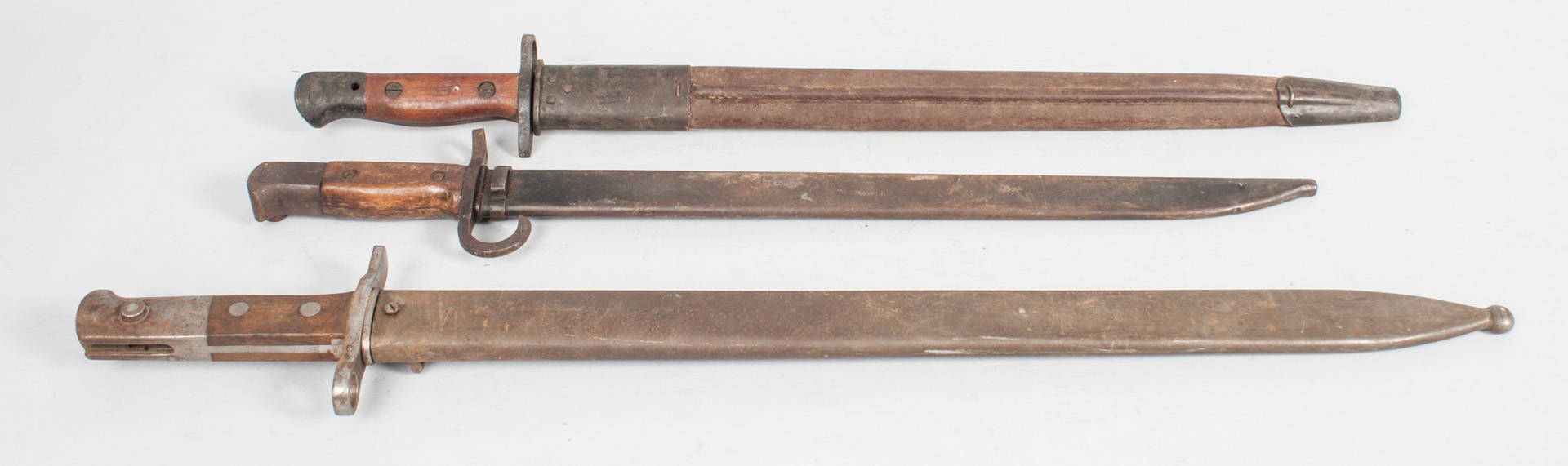 Appraisal: Three military bayonets with sheaths