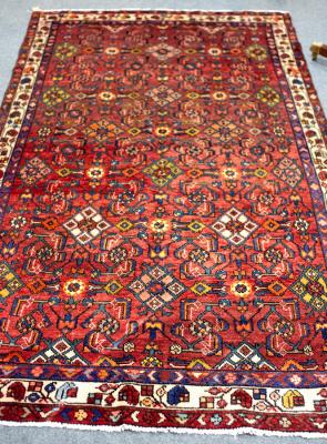 Appraisal: A Hamadan rug with claret ground the all over geometric