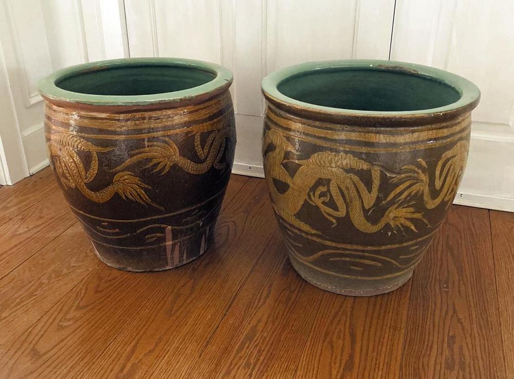 Appraisal: Near Pair Asian Dragon Motif Pottery Jardinieres glazed in varying