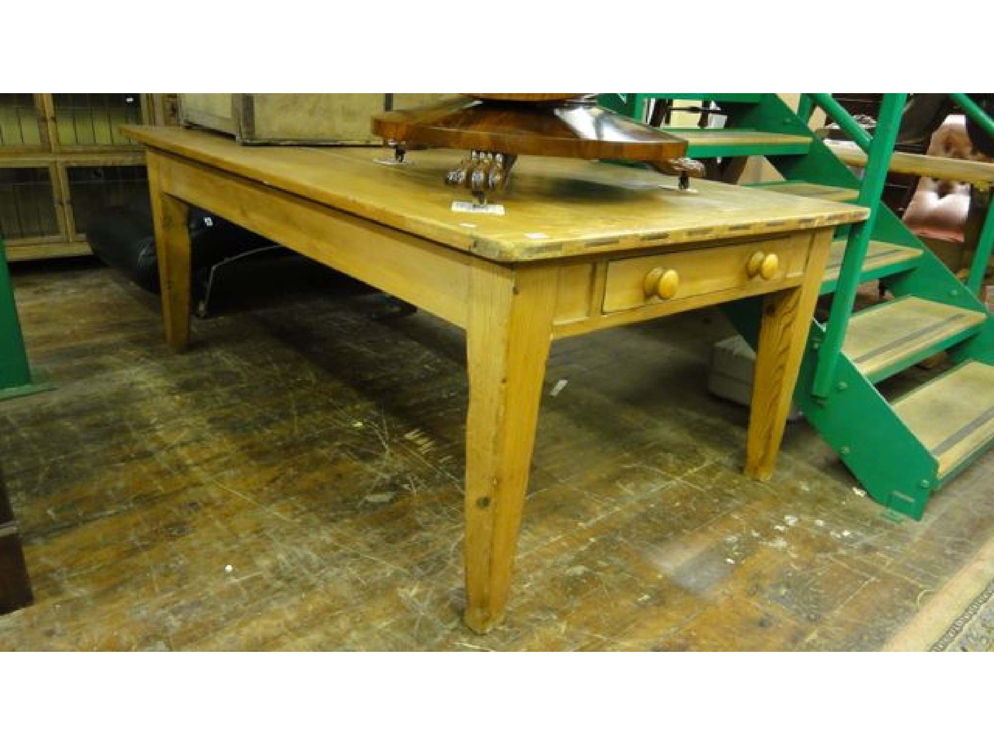 Appraisal: A substantial antique pine farmhouse table the heavy plank top