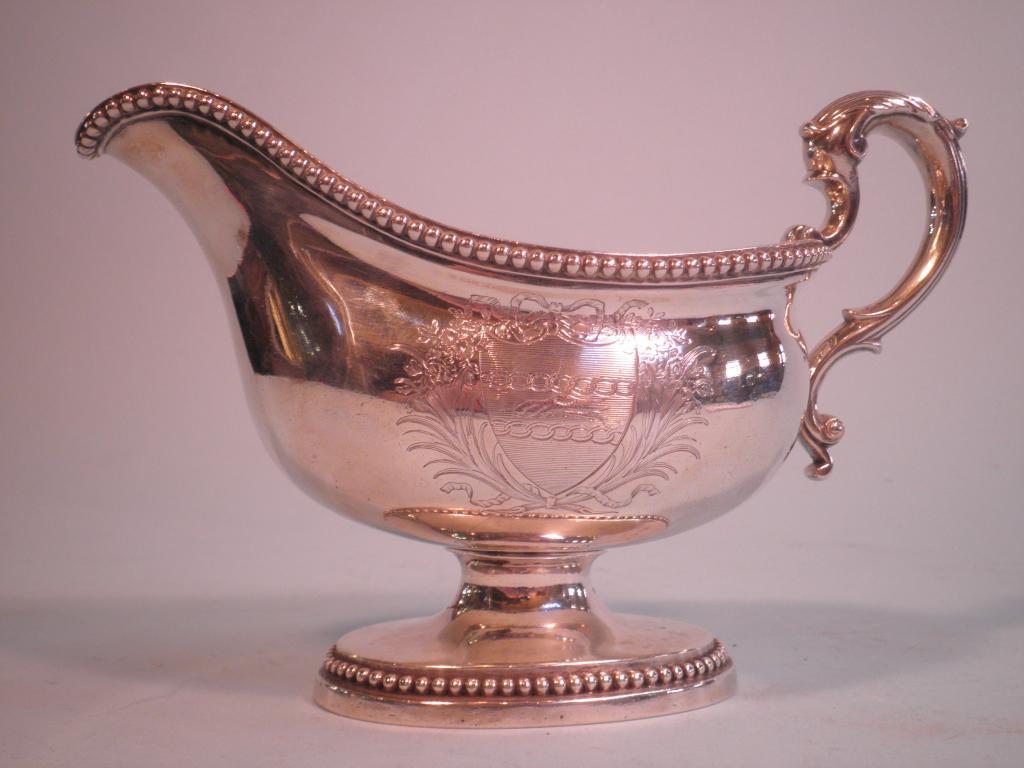 Appraisal: A George III silver gravy boat with a scroll handle