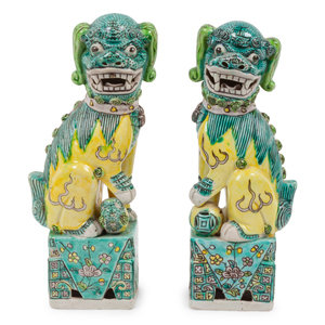 Appraisal: A Pair of Chinese Porcelain Guardian Lions Height inches