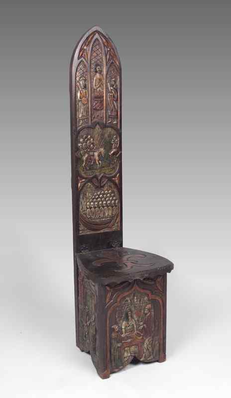 Appraisal: MEDIEVAL STYLE THRONE CHAIR Carved back medieval motifs on back