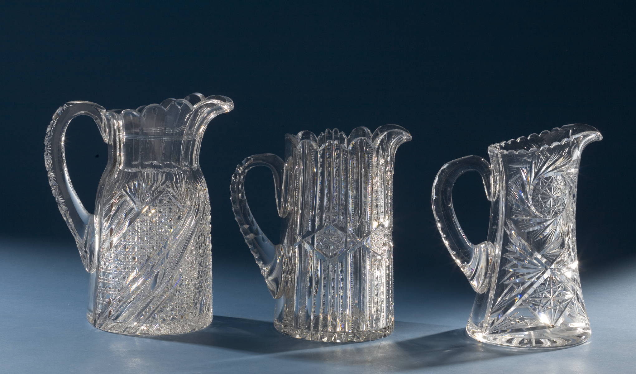 Appraisal: THREE AMERICAN BRILLIANT PERIOD CUT GLASS WATER PITCHERS