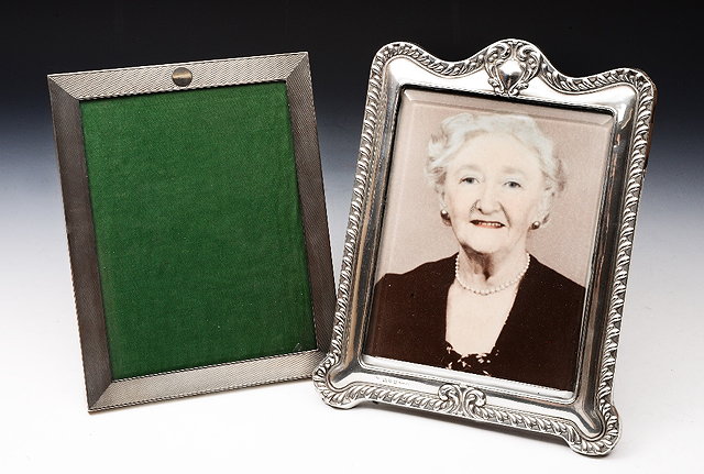 Appraisal: A RECTANGULAR SILVER PHOTO FRAME with engine turned decoration cm