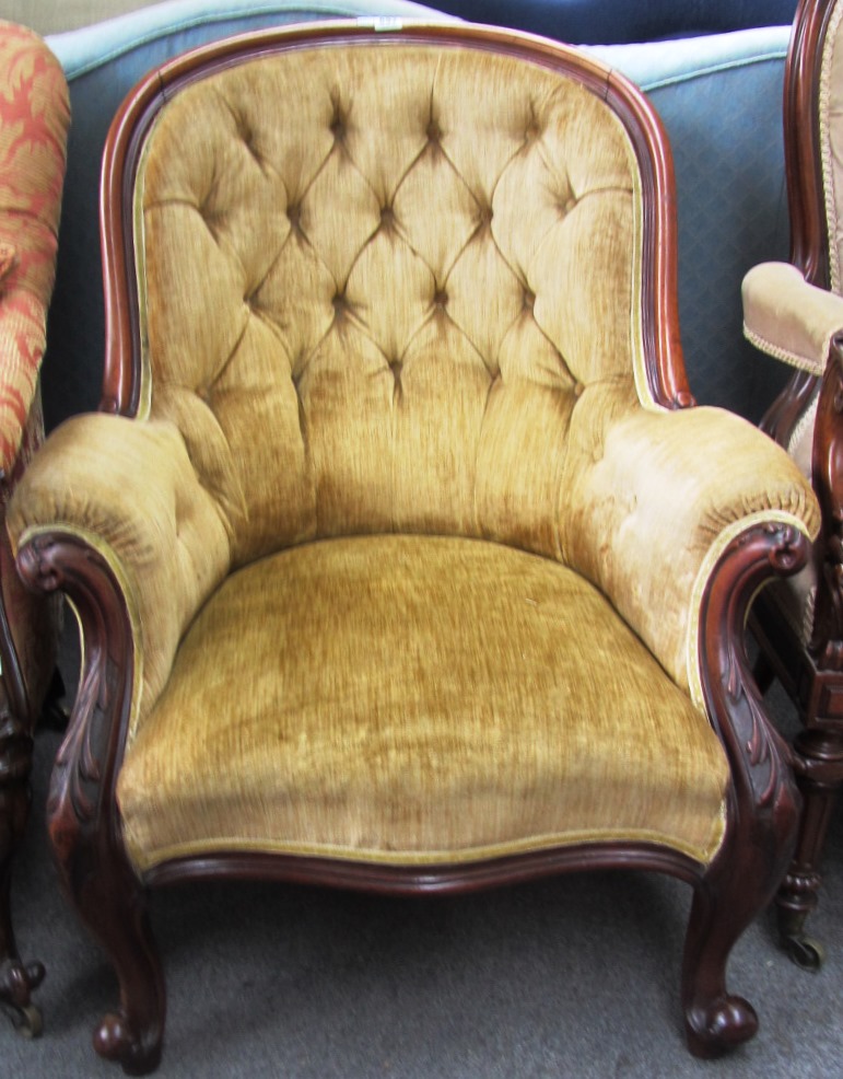 Appraisal: An early Victorian mahogany framed button back armchair on cabriole